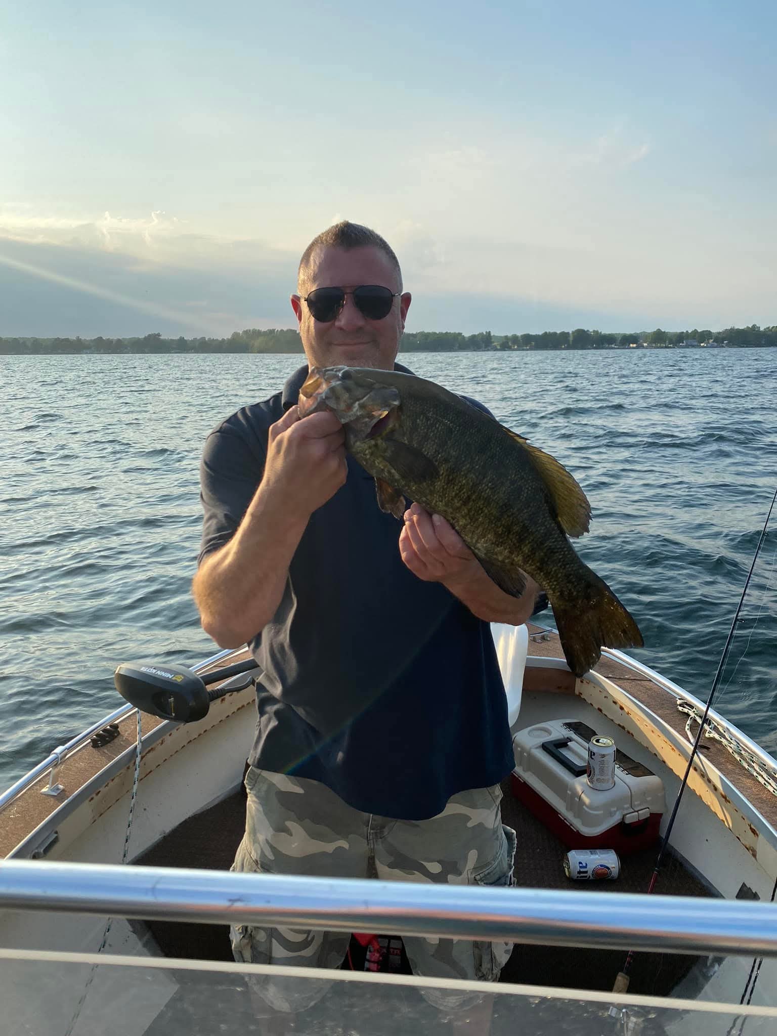 Ethan Gallagher on the water in the Thousand Islands with a smallmouth bass